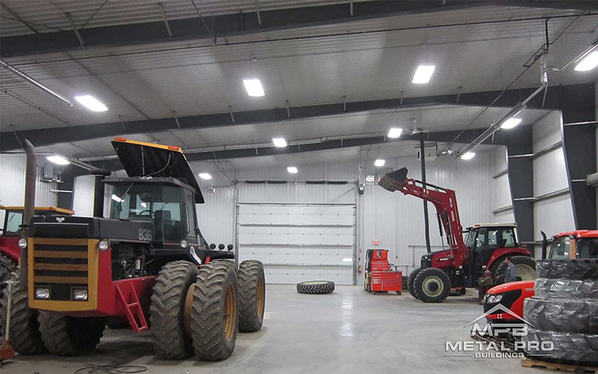 interior of an agricultural steel storage building with agricultural machinery