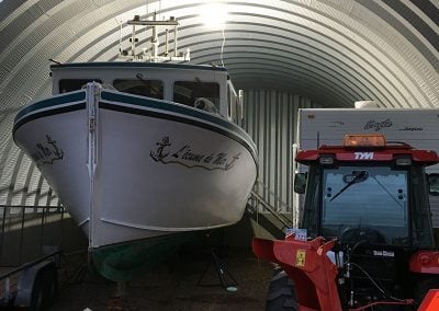 Inside the building with boat and RV