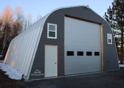 Alpine style quonset metal garage.