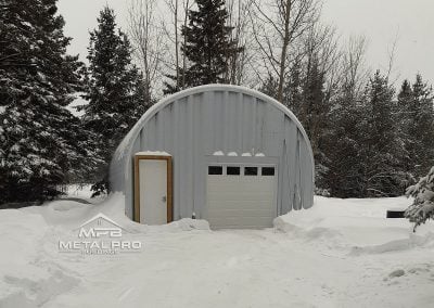 Q model style garage in winter landscape.