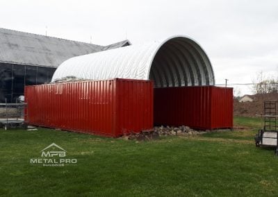 Large container cover for steel or metal building.