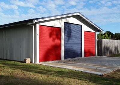 Example of one of our three door residential prefab garage kits for sale with large RV size door