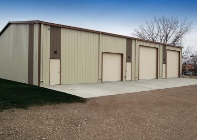 Example of one of our three door prefab garage packages for sale with 2 large RV size door