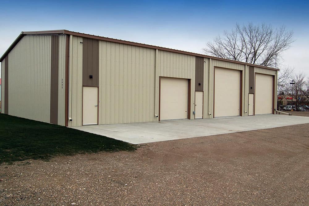 Example of one of our three door prefab garage packages for sale with 2 large RV size door
