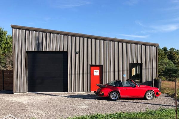 Prefabricated Steel Building with red car