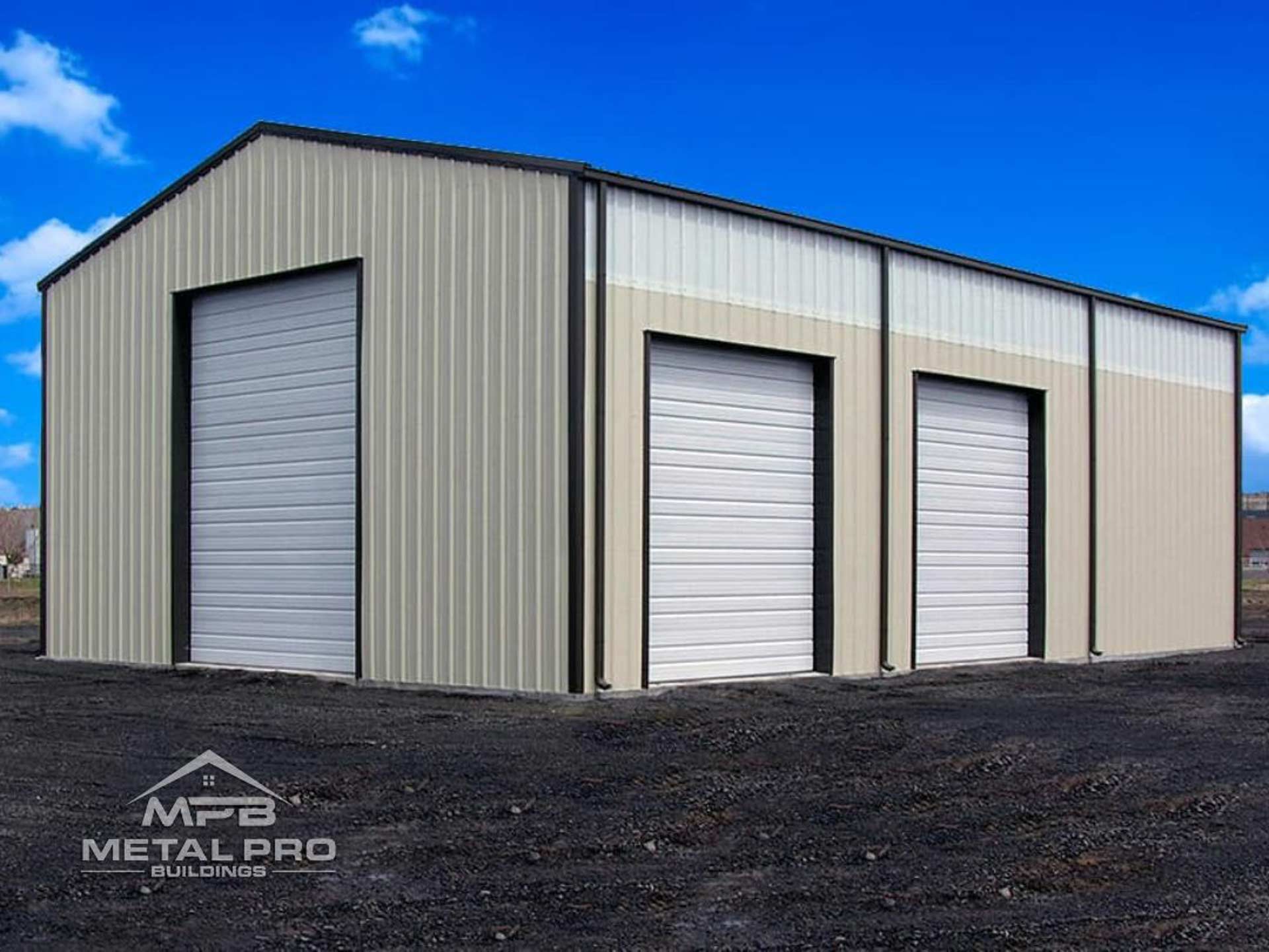 exterior of a prefab rigid steel building with three garage door openings