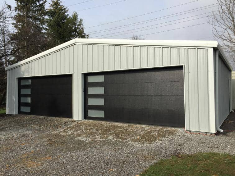 Prefab garage steel building with two doors.