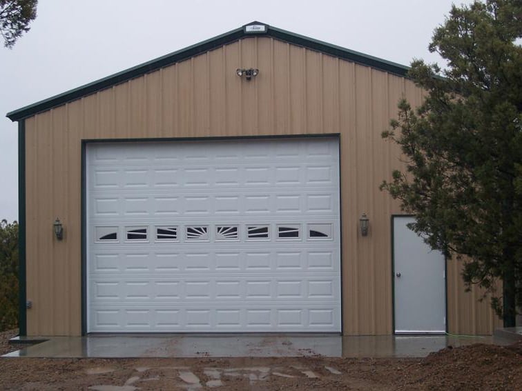 Prefab garage steel building with one door.