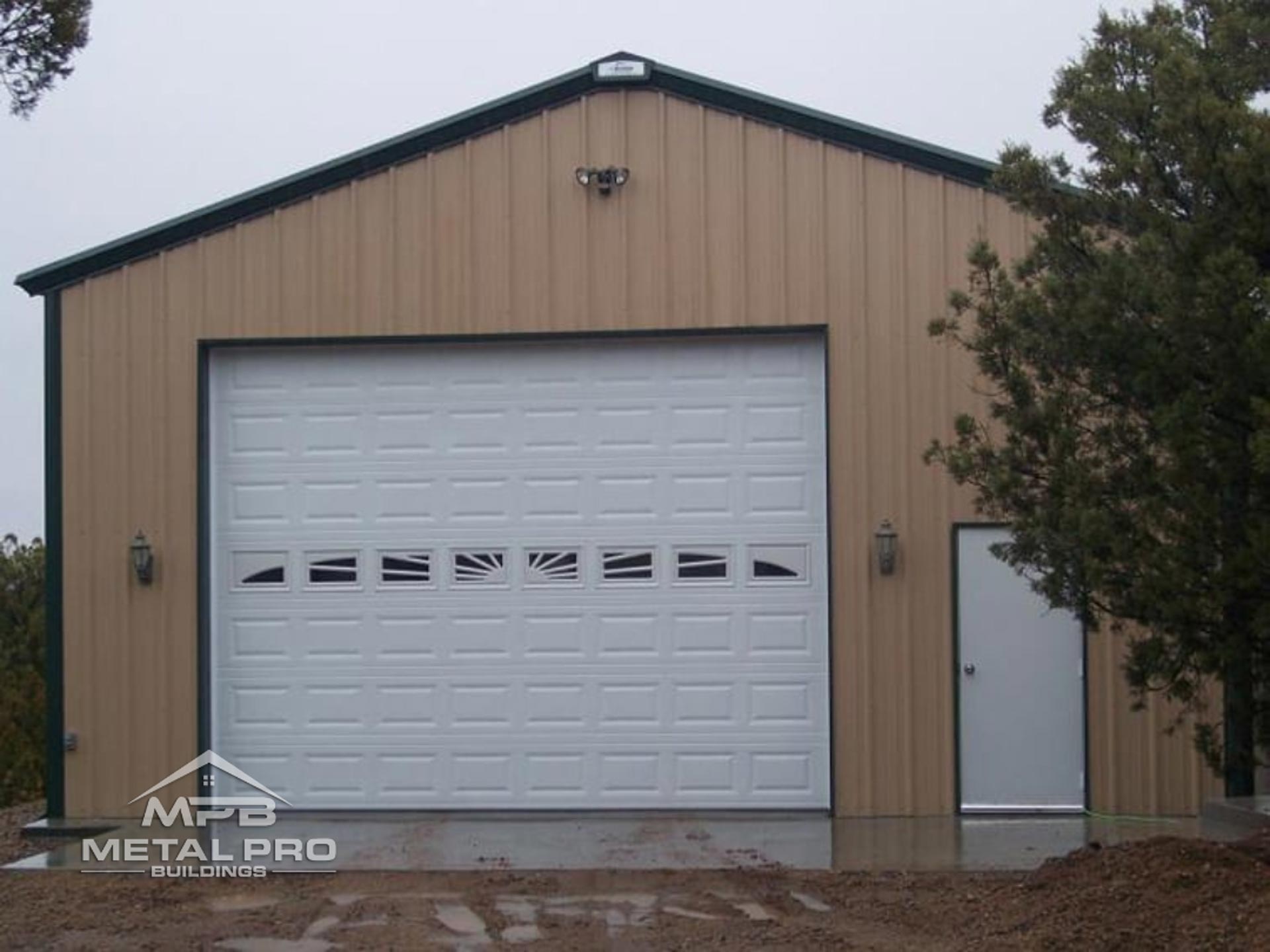 exterior of a prefab garage steel building with a service door