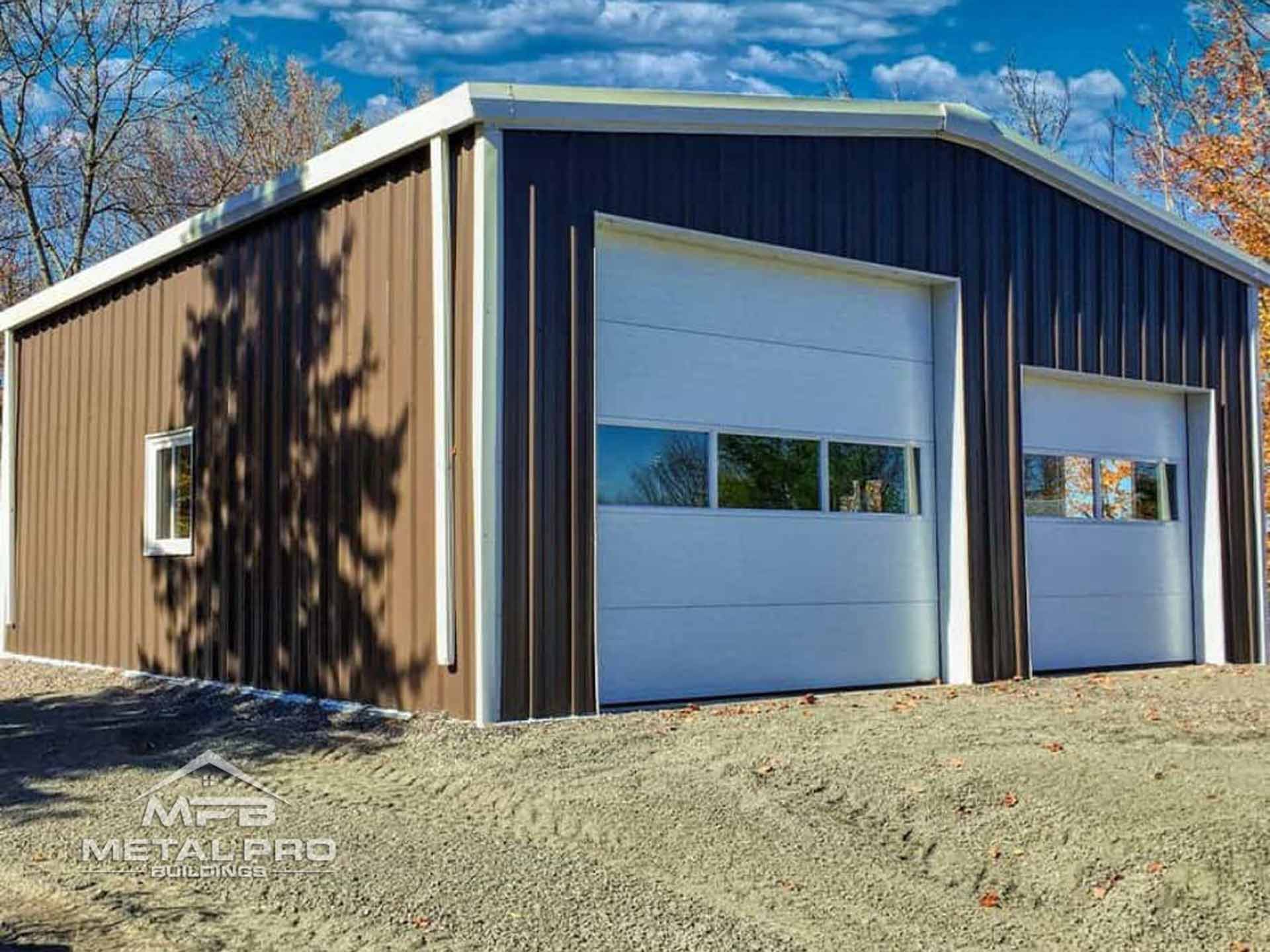 prefab garage steel building with one large door and one regular door