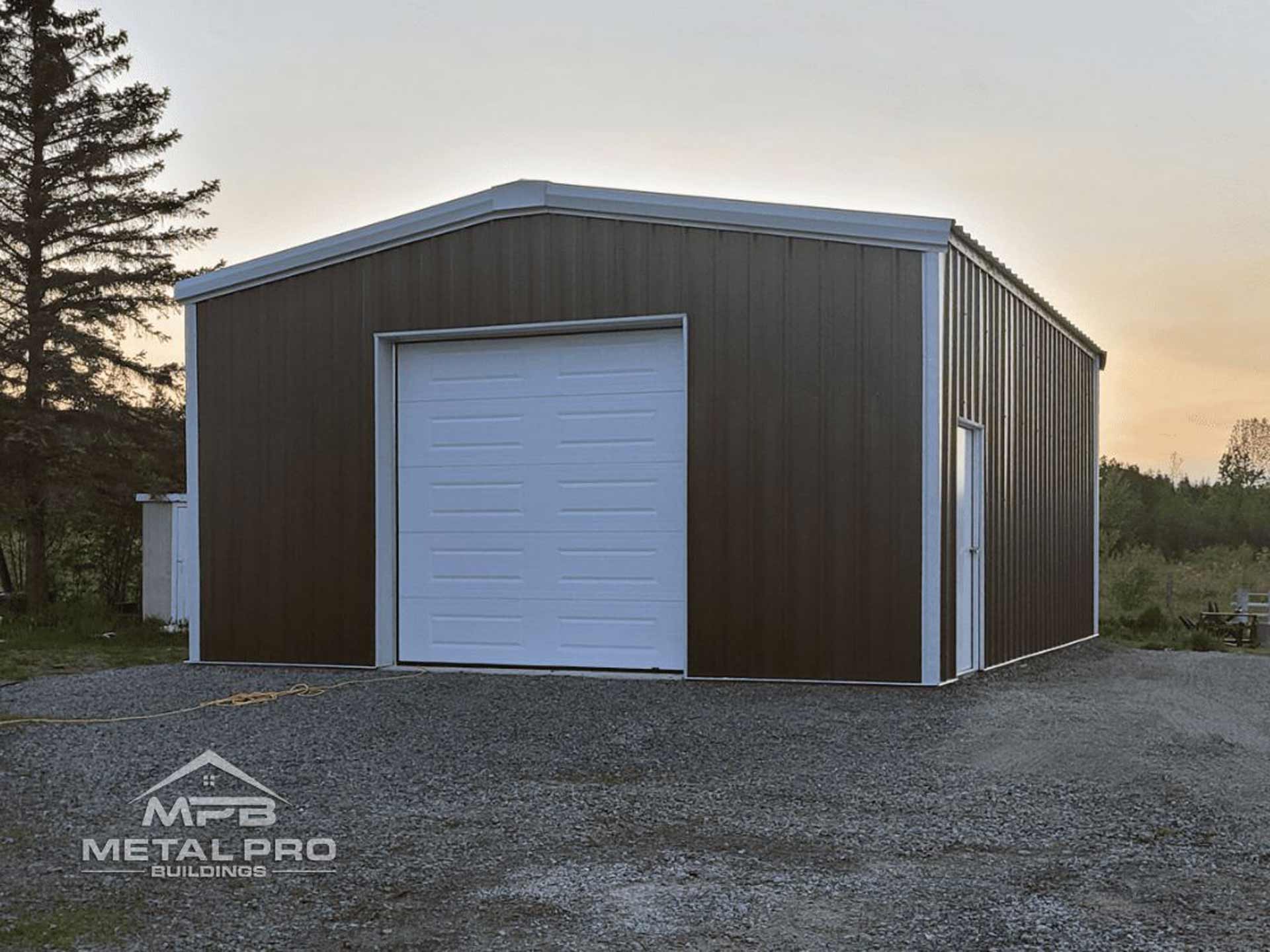 exterior of a prefab garage building with a garage door opening and service door