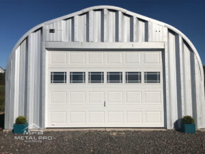 quonset hut building econospan model, steel endwall with white garage door