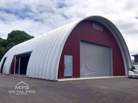 quonset hut building q model, red vinyl endwall with two garage doors and entry door