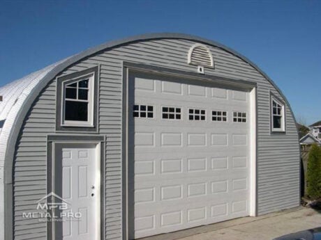 s series model white vinyl endwall with garage door, entry door, and window