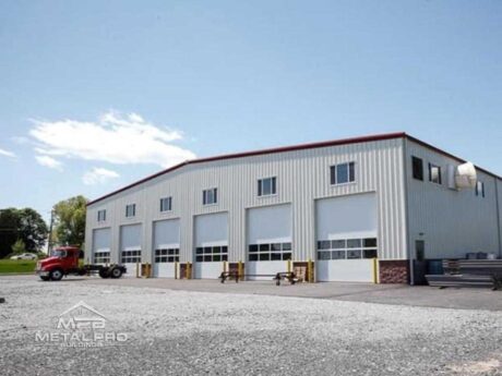 commercial steel building with six garage door openings