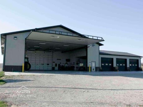 commercial steel building with four garage door openings