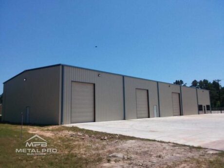 exterior of industrial steel building with three garage door openings