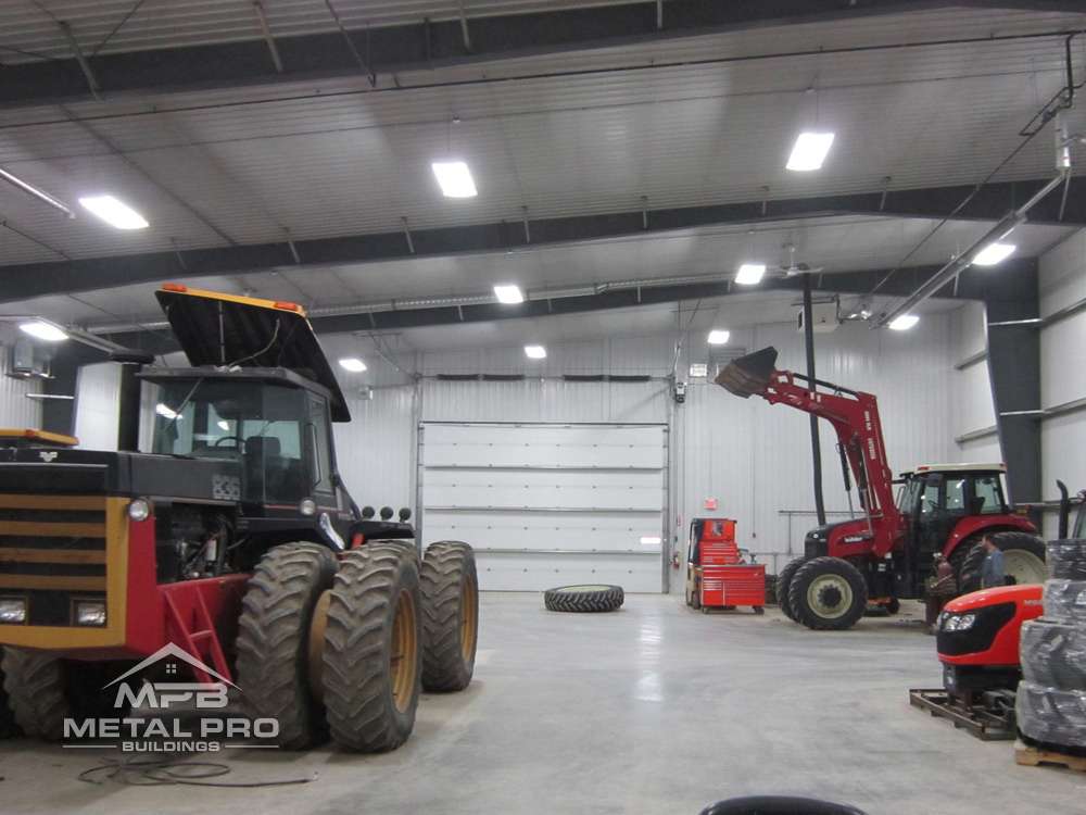 interior of an agricultural steel building with equipment stored