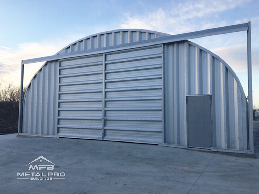 quonset hut arch steel storage building with garage and entry door