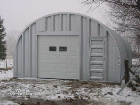 quonset hut building, steel endwall finish, with white garage and steel entry door