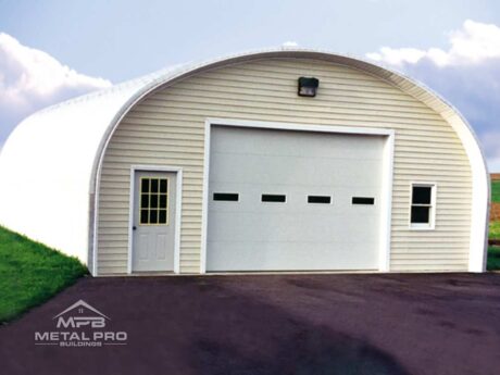 quonset hut building, vinyl finish, with white garage and entry door and windows