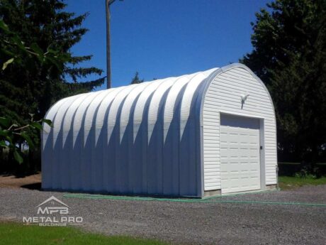 exterior of quonset hut shed with white endwalls and white garage door