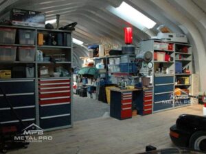 interior of steel workshop building with storage for tools