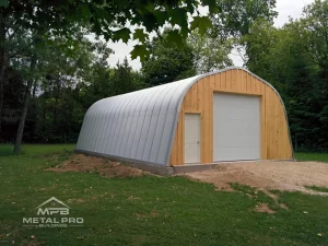 quonset hut storage building alpine model, with wood endwall, garage and entry door