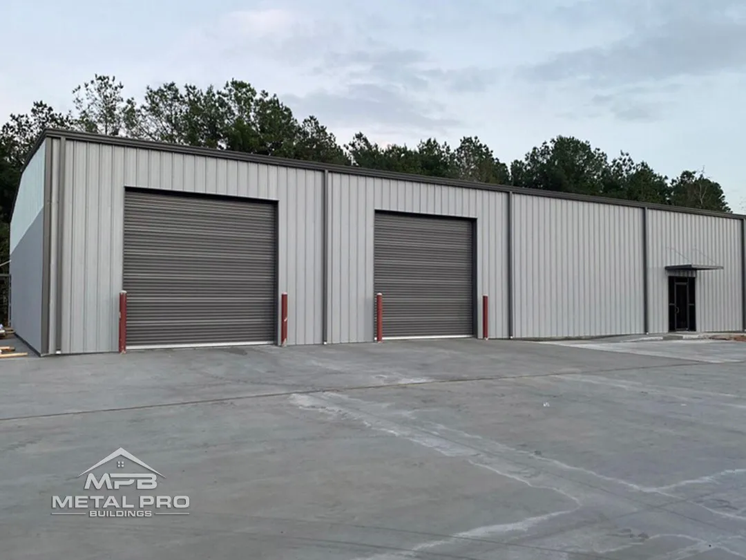 i-beam industrial building with grey painted roof, walls, and garage doors
