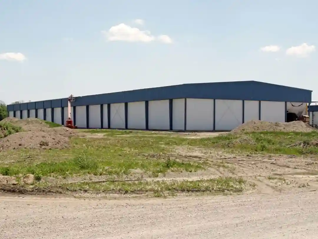 i-beam farm storage building with blue wall liner