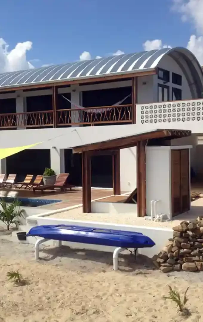 residential quonset hut q model building with view of backyard