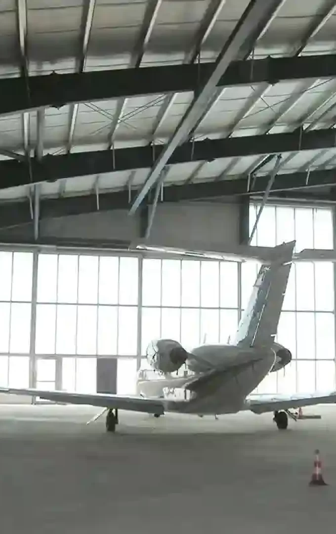 plane in a huge aircraft hangar