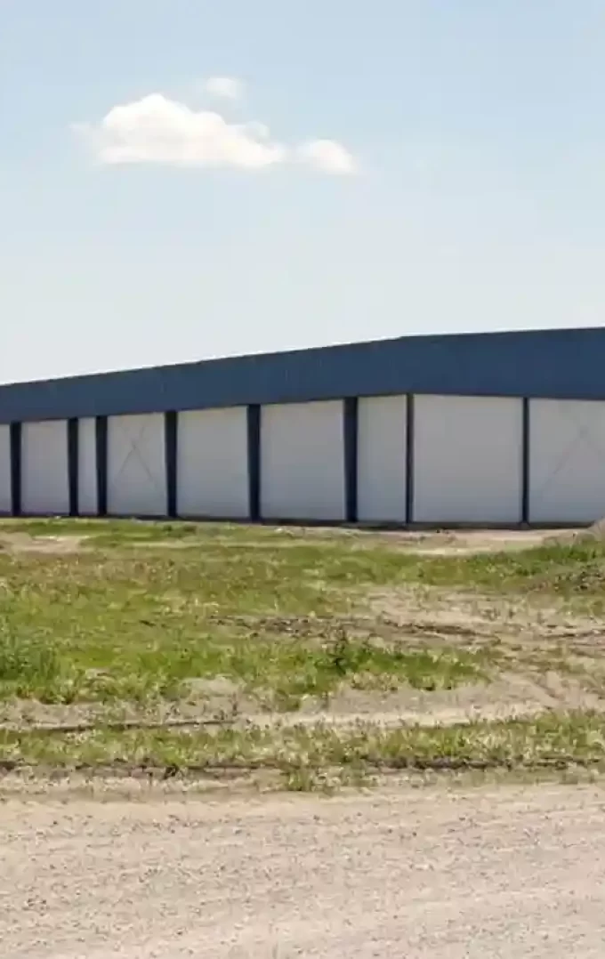 i-beam farm storage building with blue wall liner