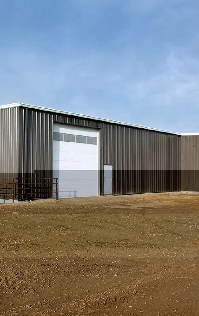 brown horse riding arena with garage door
