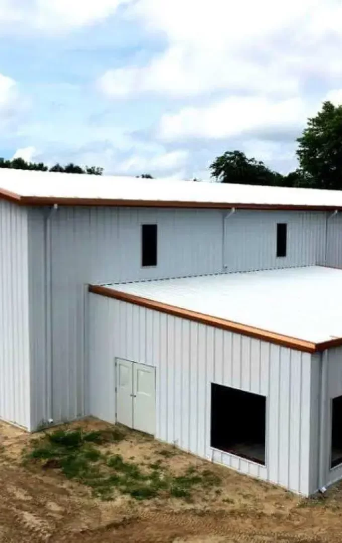 straight wall steel warehouse building painted in white